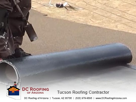 rolled roofing being applied to a flat roof in Tucson, AZ