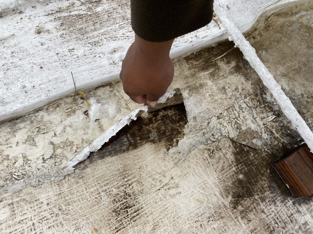 DC Roofing inspecting a roof inspecting a roof